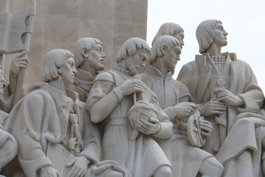 close up of navigators on monument showing items they're carrying