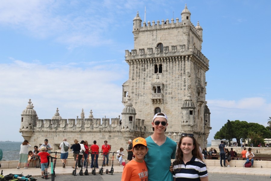 Belem with kids in front of Tower of Belem Lisbon