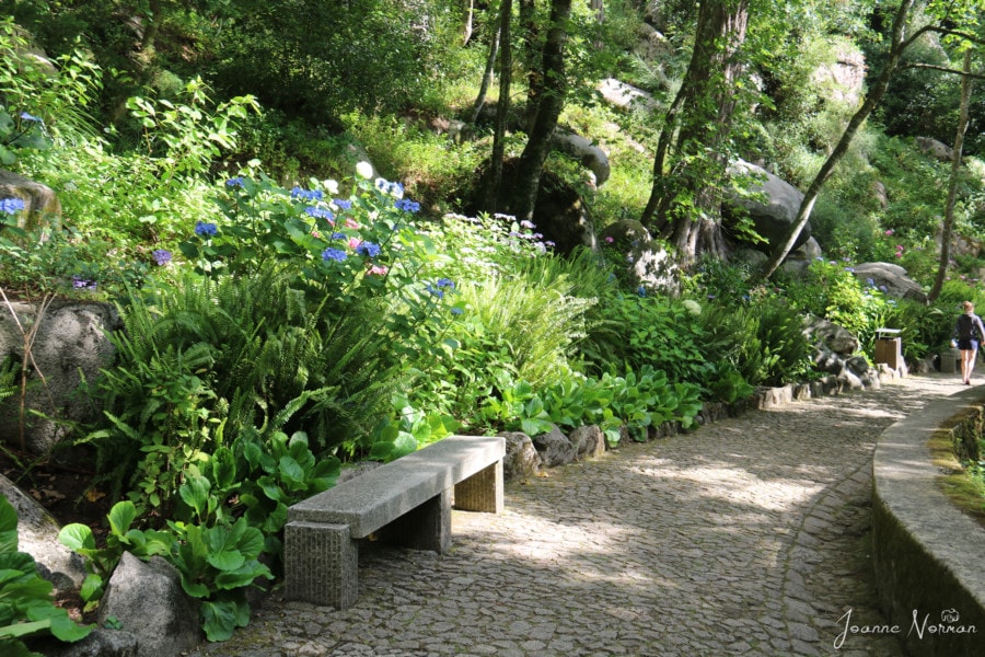 walkway with stone bench and flowers on daytrip from Lisbon to Sintra