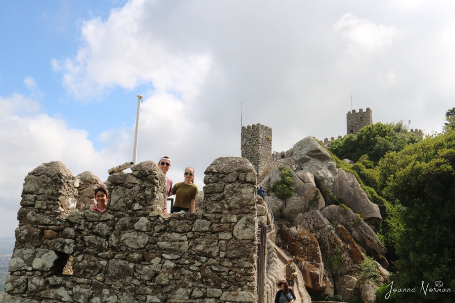 my three kids at top of wall of Castle of Moors Sintra looking over the edge