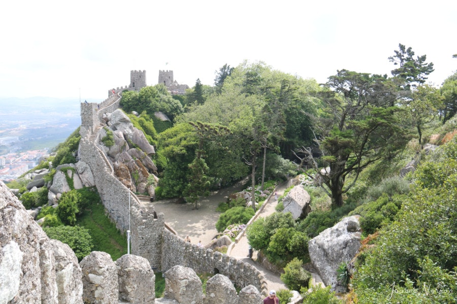 Castle of Moors in the distance as viewed from along the walls of the castle on daytrip from Lisbon to Sintra