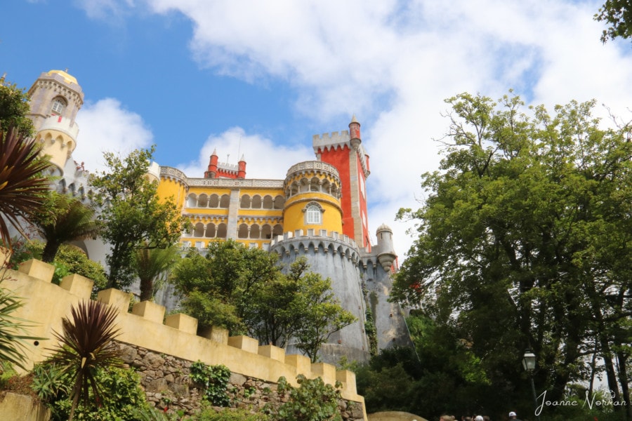 bright yellow and orange palace as viewed from below