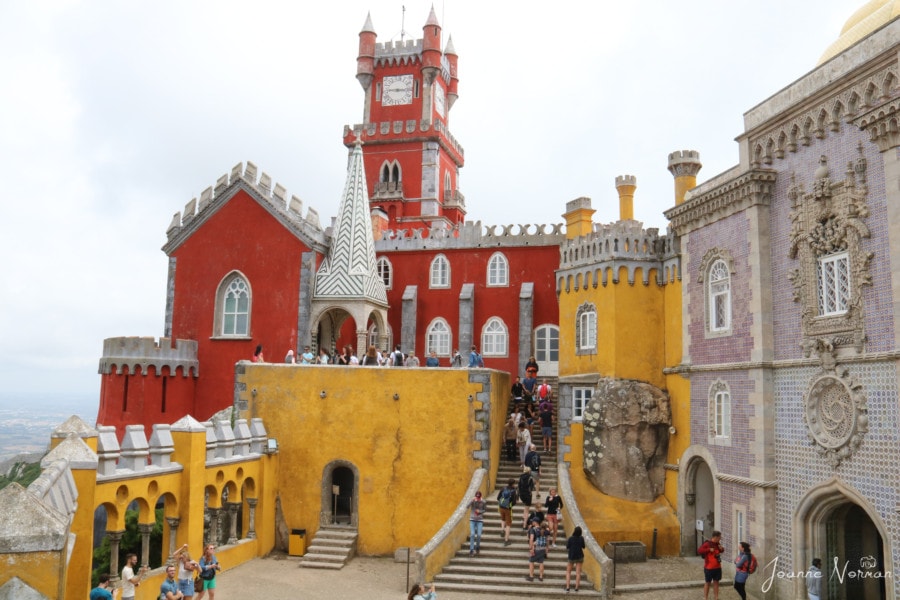 terrace with orange and yellow buildings at Pena Palace