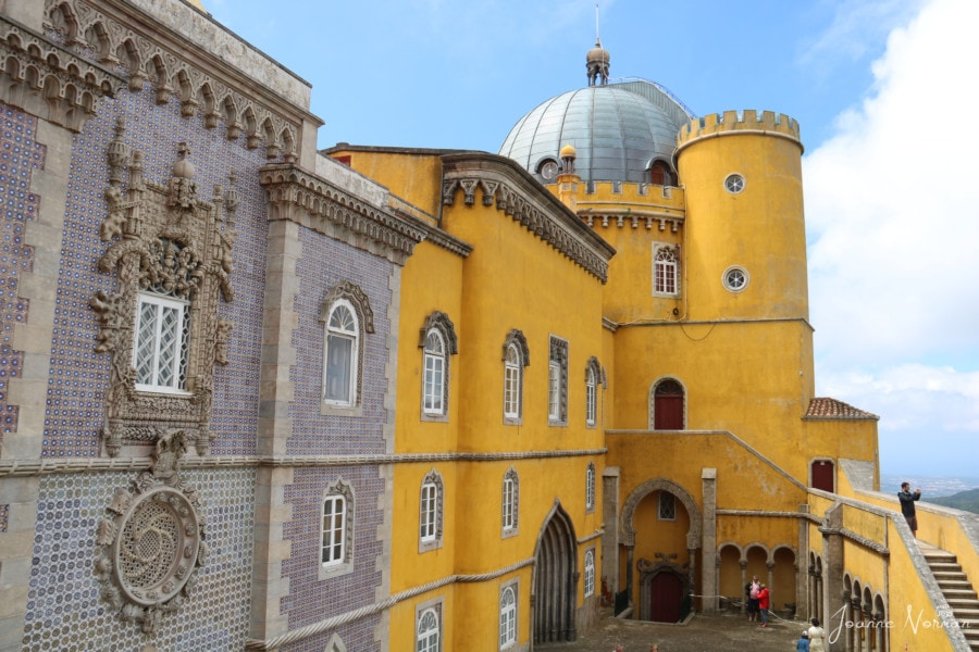 yellow rounded building with dome on top