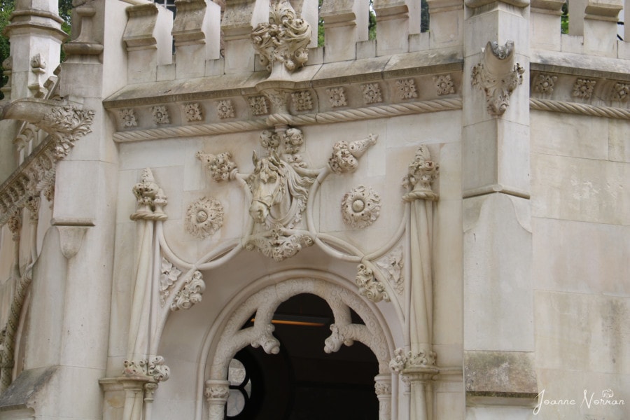 decorative archway in white stone with 3D horse head