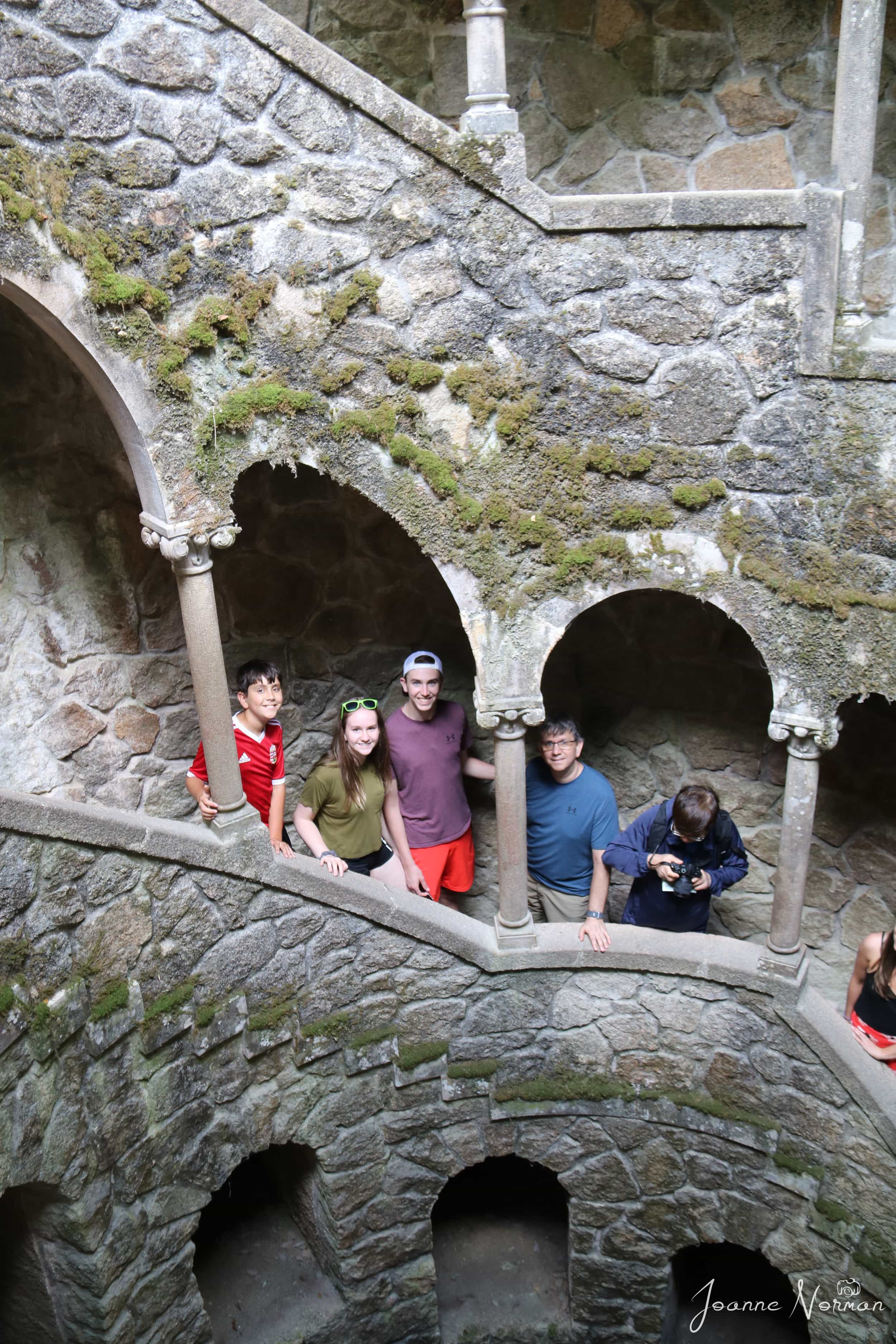 looking down at family as they walk down spiral well