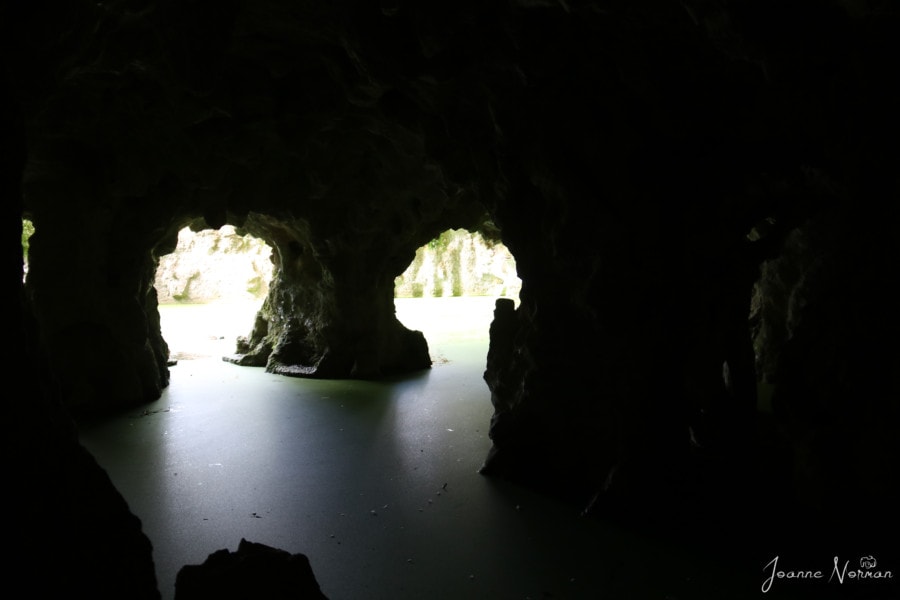 looking out of cave from double opening