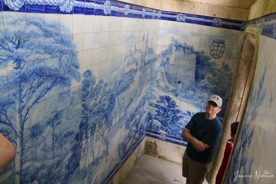 John in front of blue tiled walls