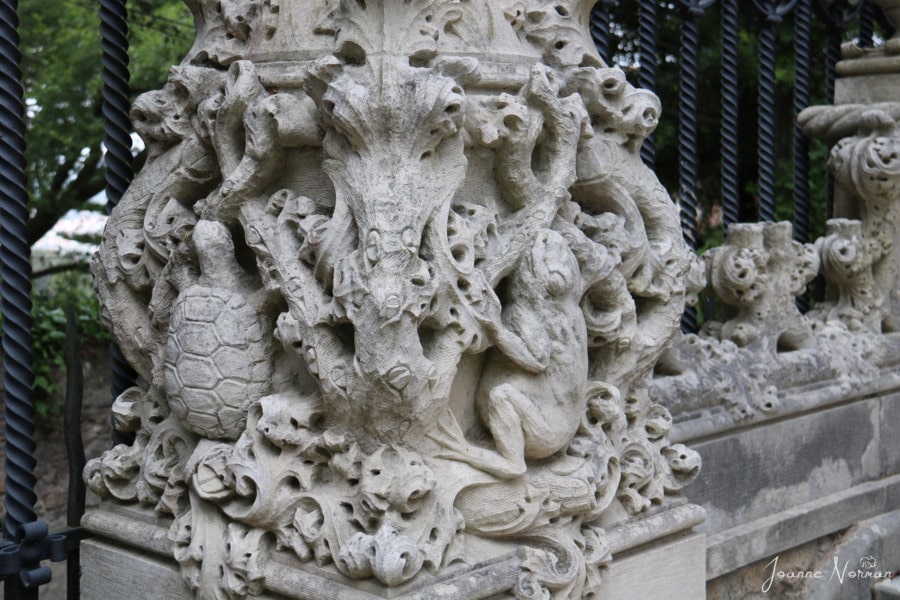 base of pillar on palace with stone frogs