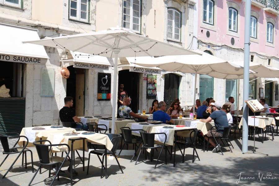 exterior of Canto Saudade alfama restaurant outdoor terrace with umbrellas is seafood restaurants in Lisbon