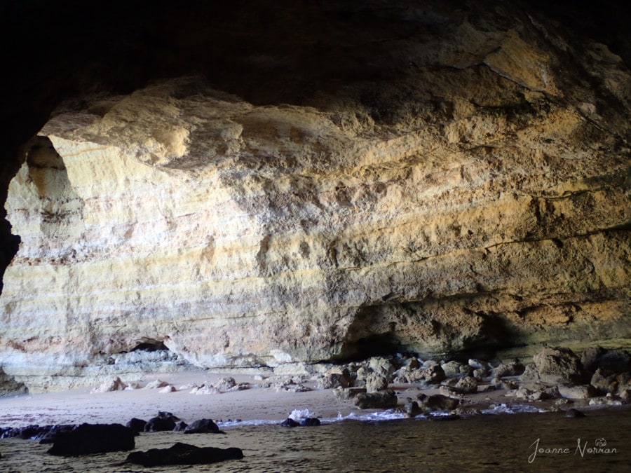 cave with purple sand base and lined sandstone Carvoeiro Cave Boat Tour