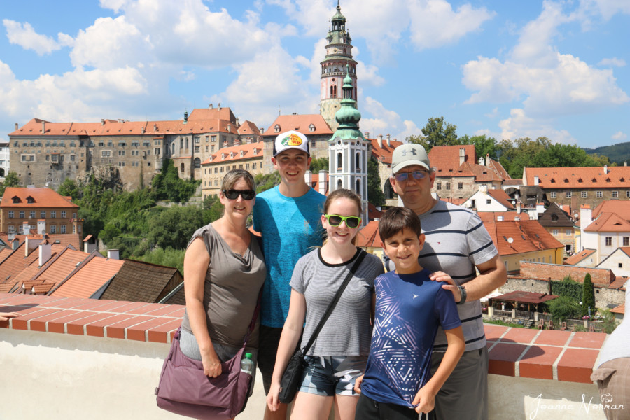family photo with castle behind us great thing to do in Cesky Krumlov