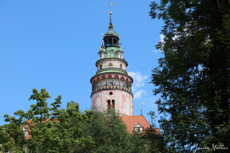 colourful castle tower in pinks and greens things to do in cesky krumlov with kids