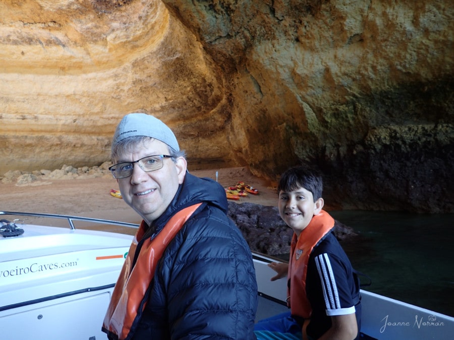 John and Caiden in boat inside Benagil Cave smiling