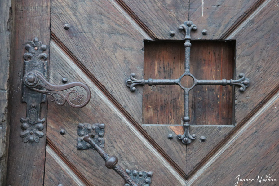 wooden door with curly handle
