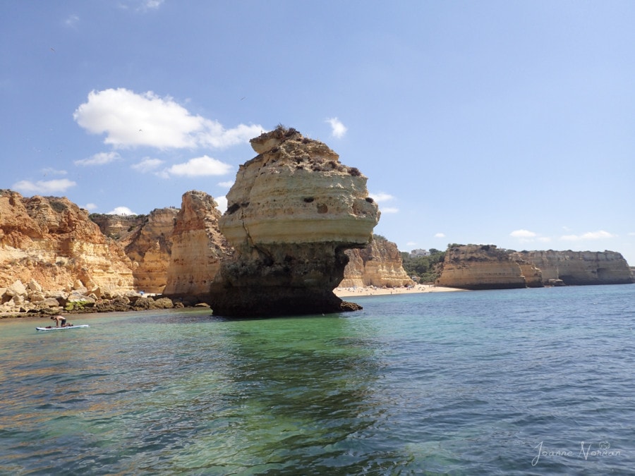 large rock formation in ocean at praia da Marinha Carvoeiro Algarve Portugal