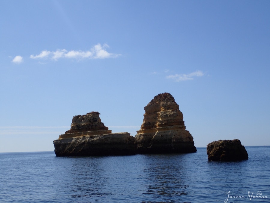 boat shaped sandstone rock in ocean sandstone rock in water Ponta da Piedade Lagos