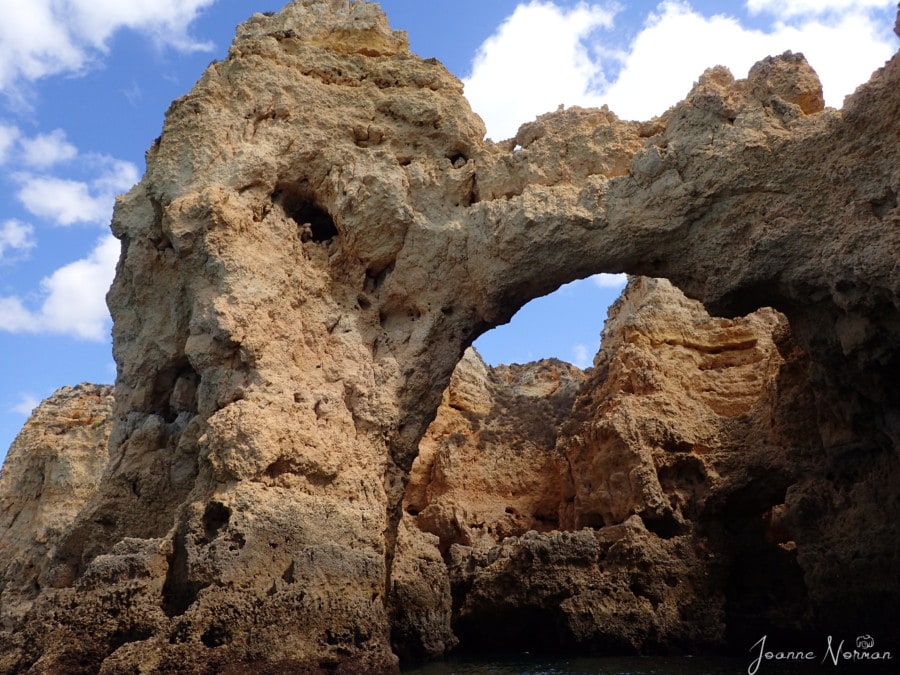 massive sandstone rock formations with arches and holes Ponta da Piedade Lagos Carvoeiro