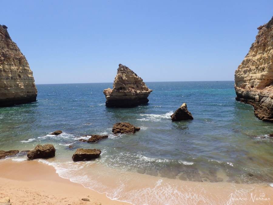 Sandstone rock formations jutting from ocean things to do in Carvoeiro