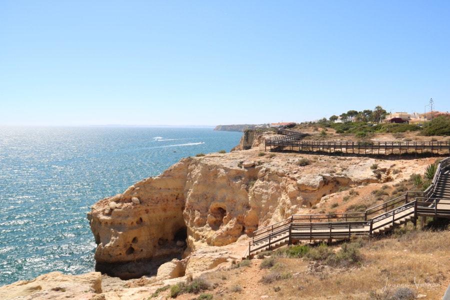 wooden boardwalk with railing on sandstone cliffs things to do in Carvoeiro