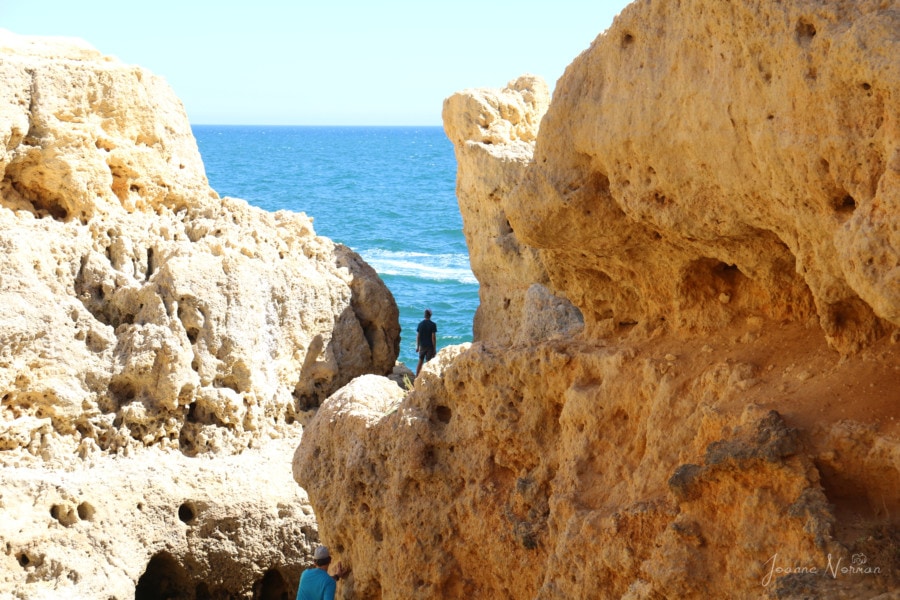 our family walking among the cliffs is great things to do in Carvoeiro Algarve Portugal