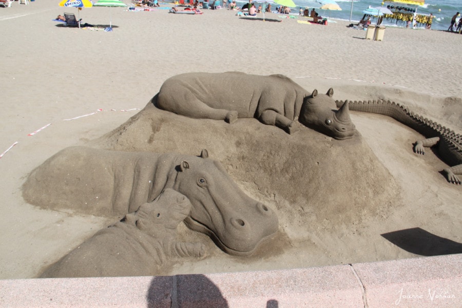 hippos and rhinos made of sand on the beach Costa del Sol Spain with kids