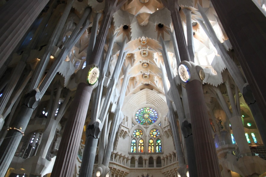 stained glass windows and white interior of Sagrada Familia