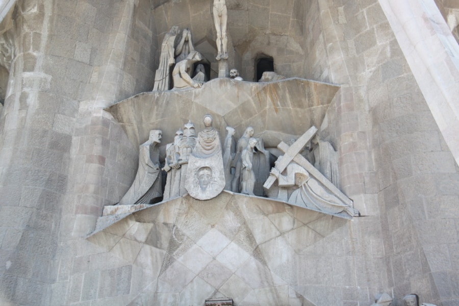 carrying of cross and death of Christ carved in stone at Sagrada Familia Passion Facade