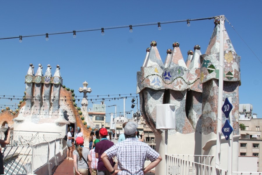 colourful rooftop of Casa Mila including towers that look like soldiers is cool thing to do in Barcelona with kids