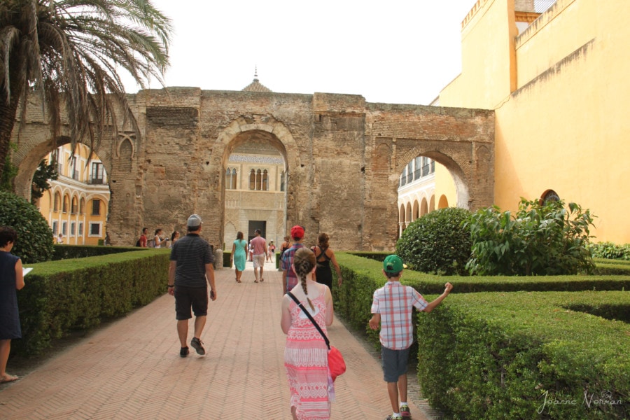 family entering archway at alcazar in Seville during 3 days in Seville