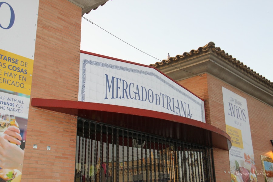 blue and white sign for Mercado de Triana things to do in Seville