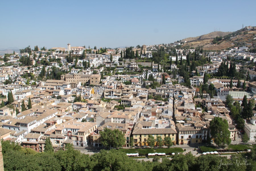 a view of the white houses and carmens of the Albaicin as seen from the Alhambra 