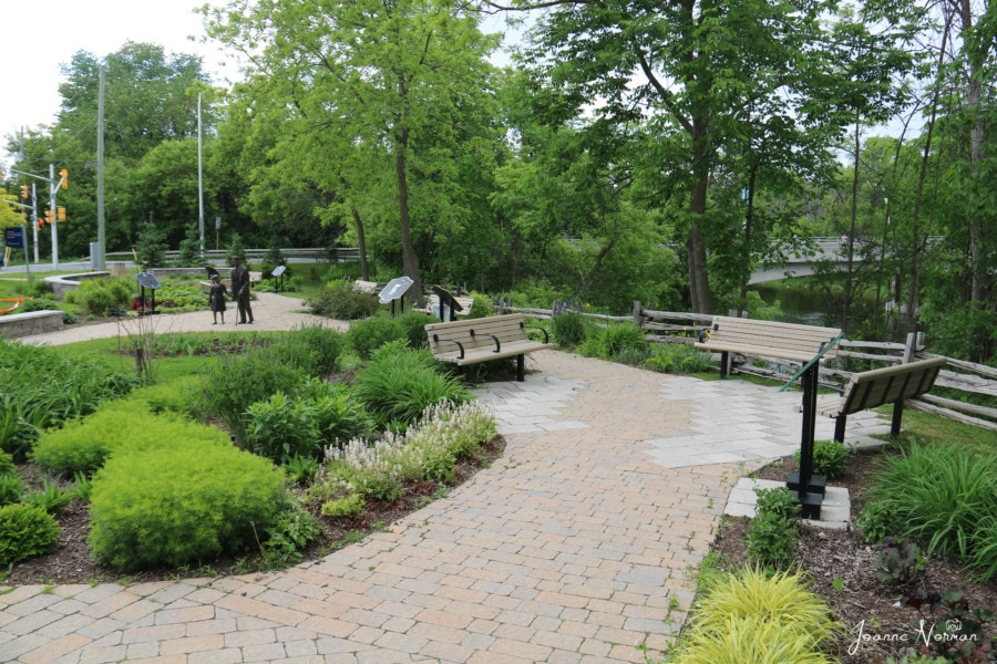 park with benches and cobblestone paths