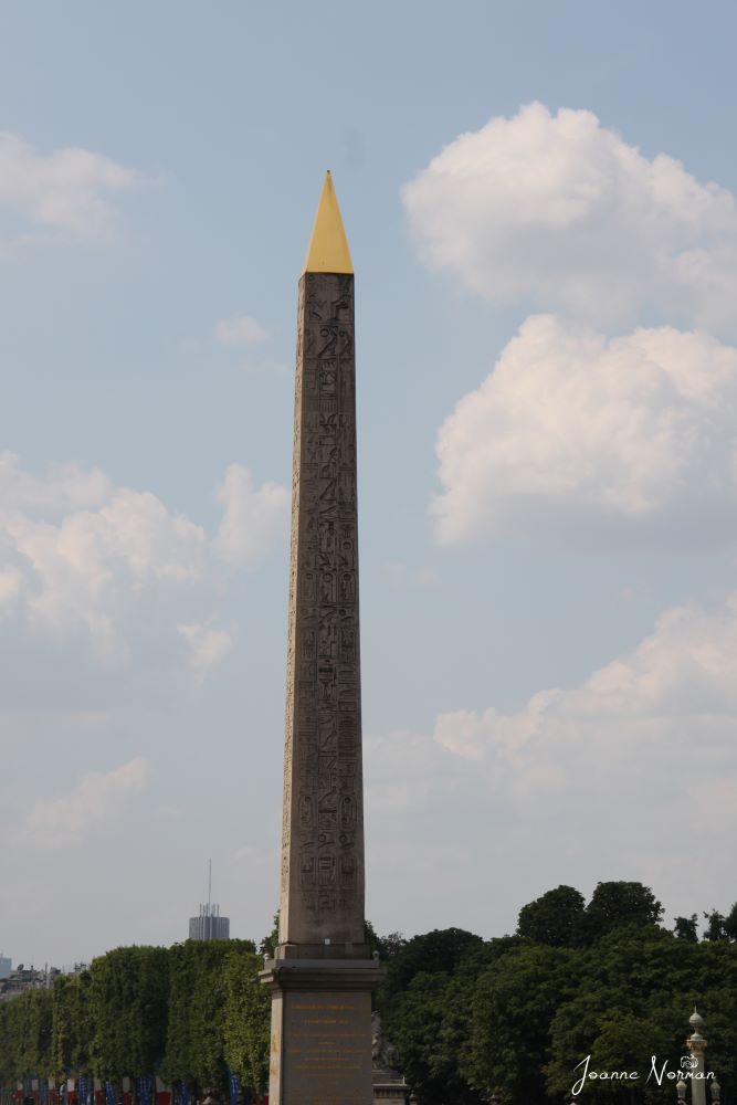 tall stone pillar with gold cone on top is hidden gem in paris