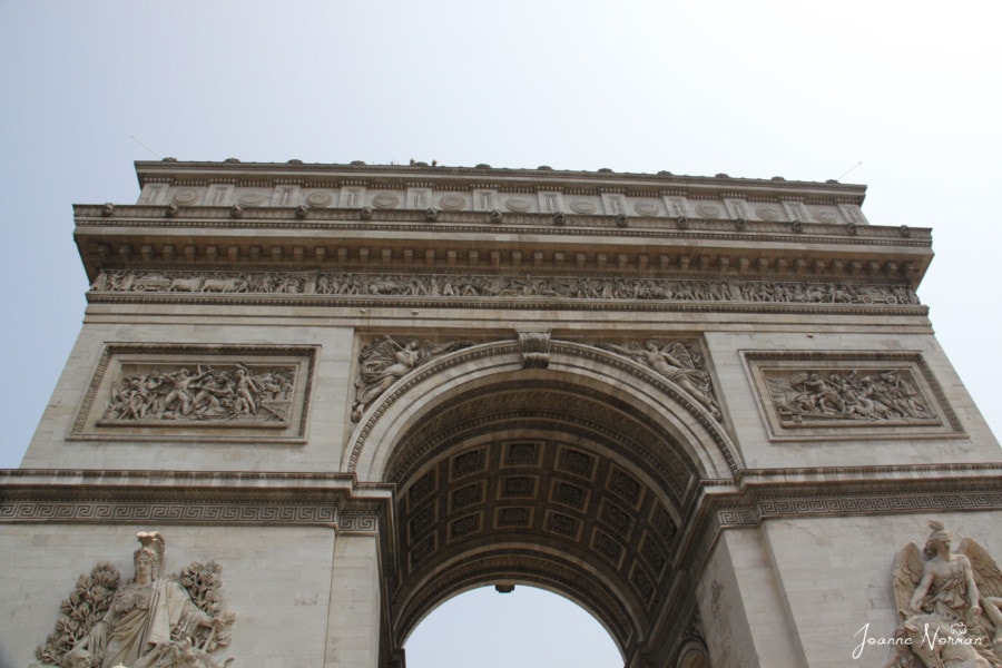 up close view of arc de triomphe from ground paris holidays