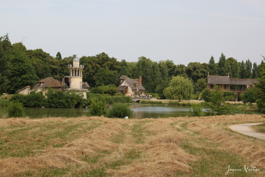 natural pond with old village beyond