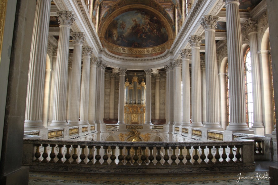 inside of palace with white walls and gold trim Paris to Versailles