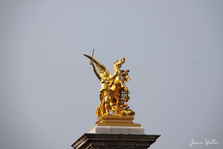 gold horse with wings and lady paris holidays