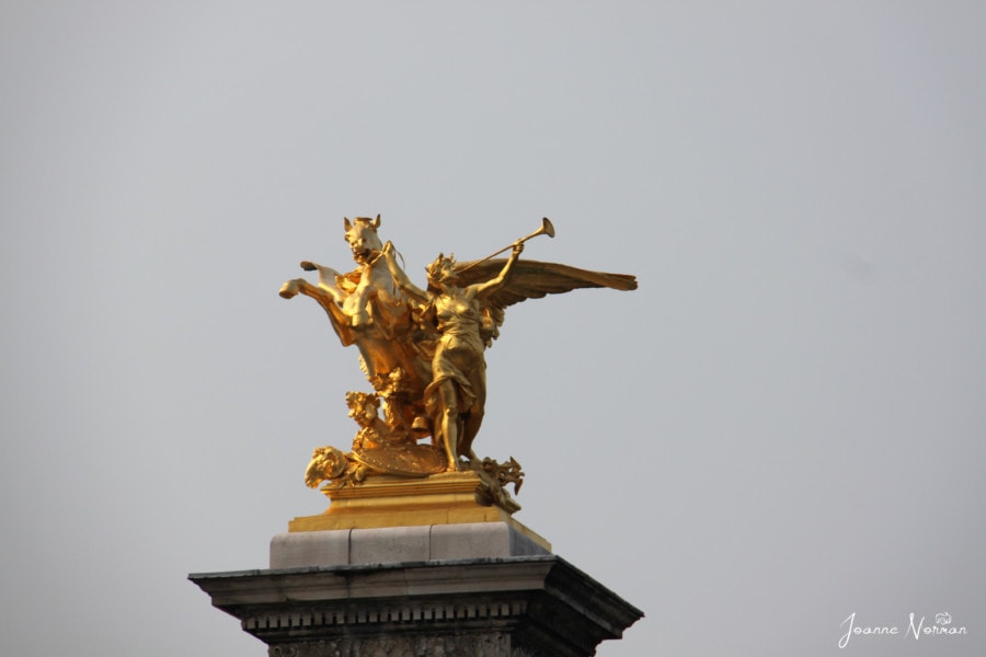 gold horse with wings and lady with gold trumpet paris itinerary