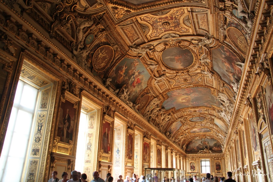 long room with golden decorative ceiling and walls at Louvre Paris holidays
