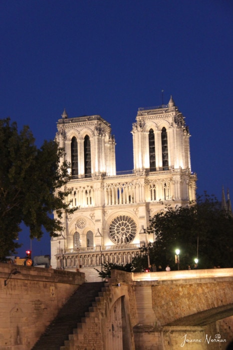 notre dame glowing at night
