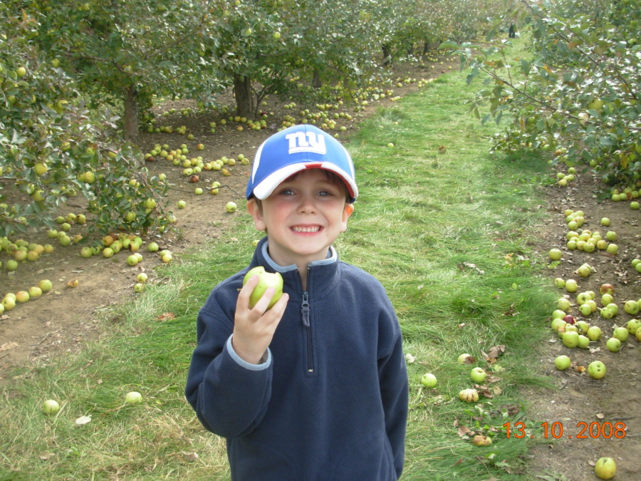 boy enjoying apple