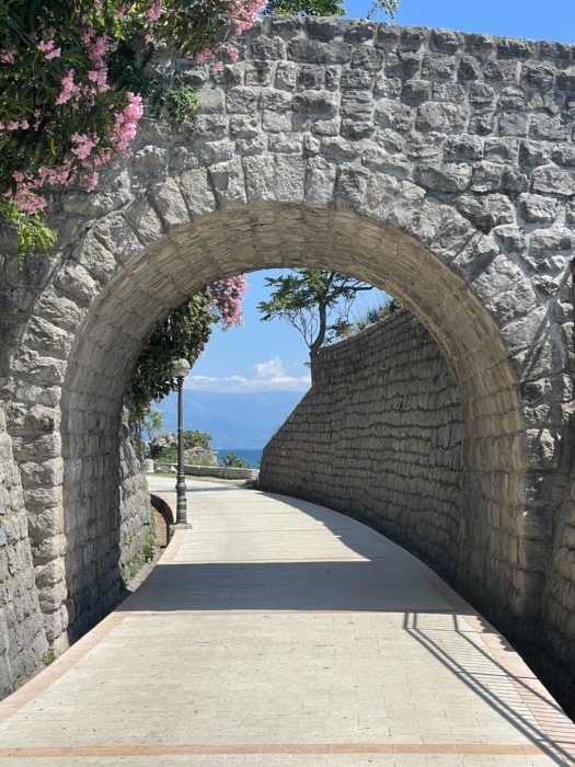 stone archway over danika waterfront walkway