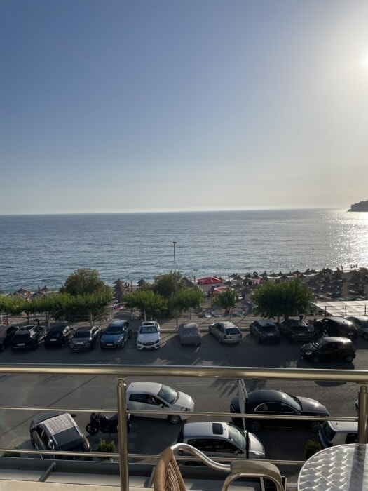 view from room himare overlooking road and beach towards water