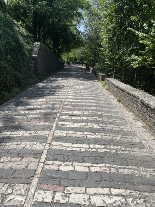  stone road uphill to castle Gjirokaster Albania Travel itinerary