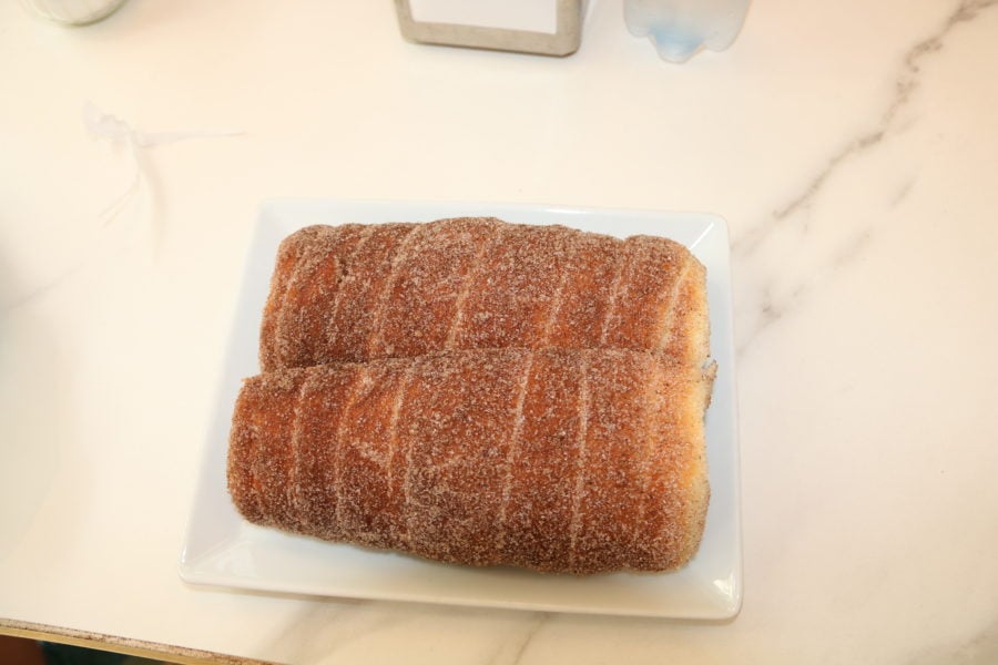 two chimney cakes on plate covered in cinnamon is our favourite Budapest food